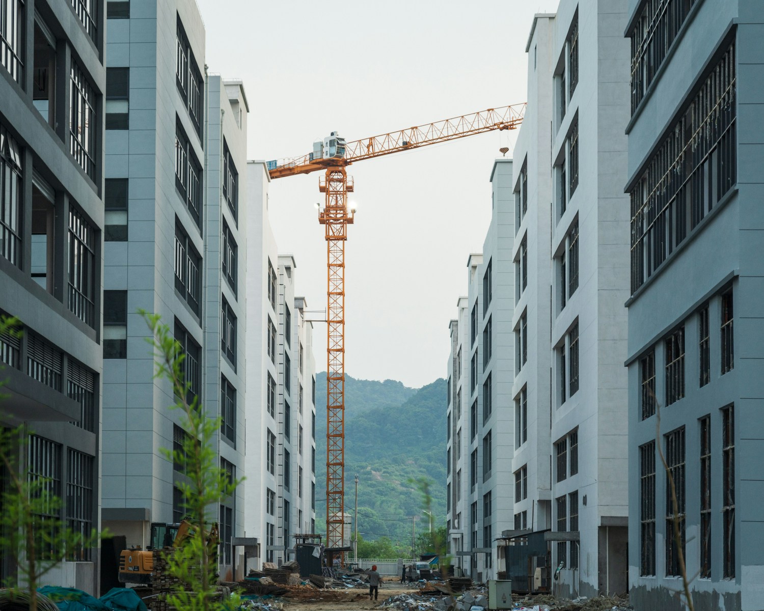 a crane is in the middle of a construction site