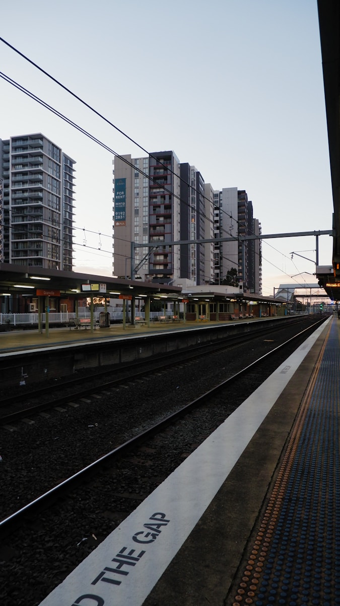 a train station with a train on the tracks